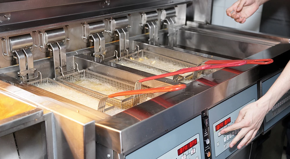 Commercial deep fryer generating used cooking oil in a Long Beach food service establishment.