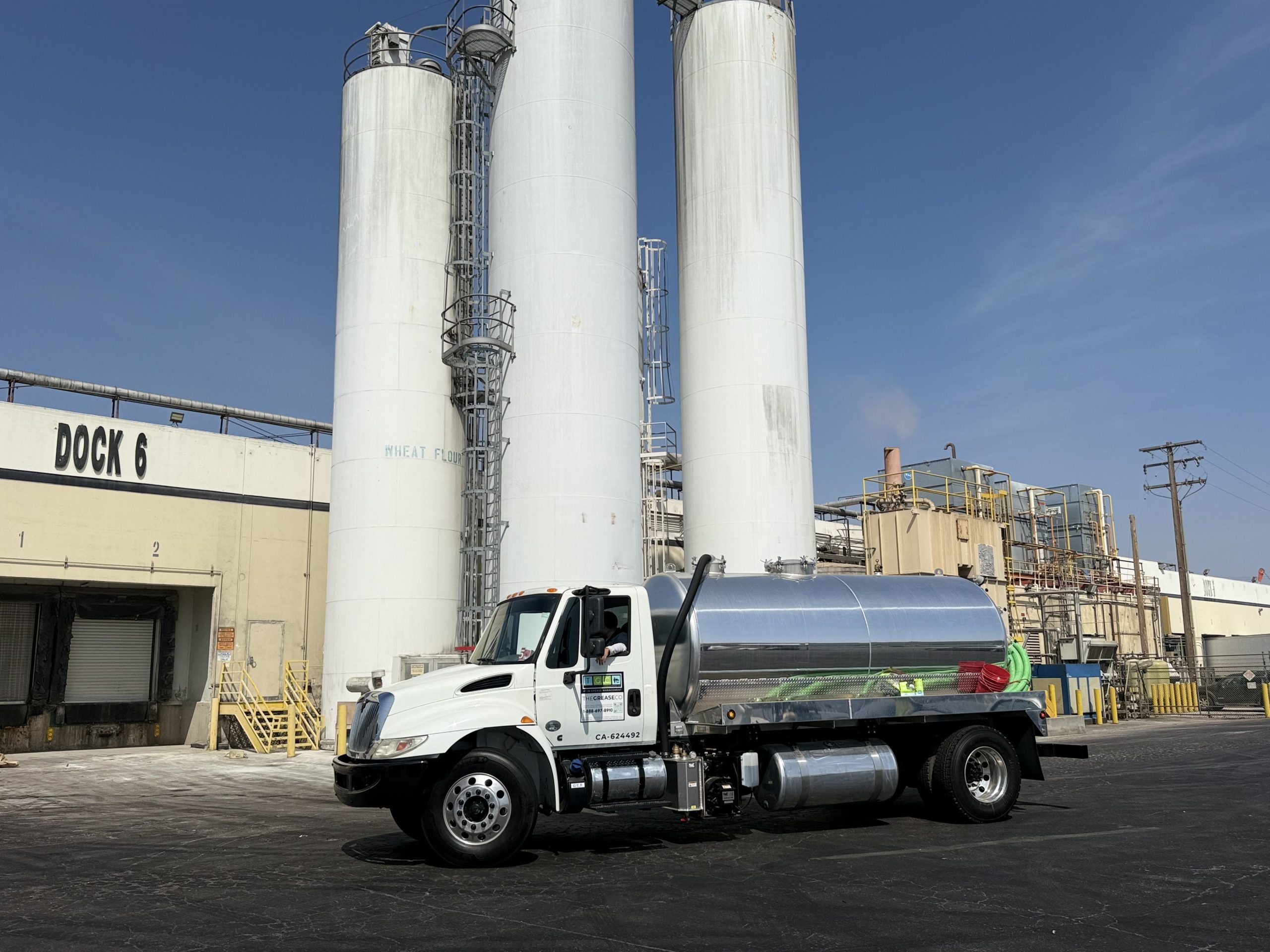 Grease management company service truck at recycling facility